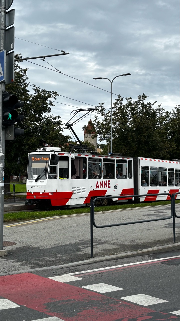 A red and white Tallinn tram with ANNE written on its side